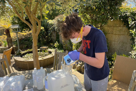 King Edward’s Witley pupil Christopher Hooper making hand sanitiser at his home